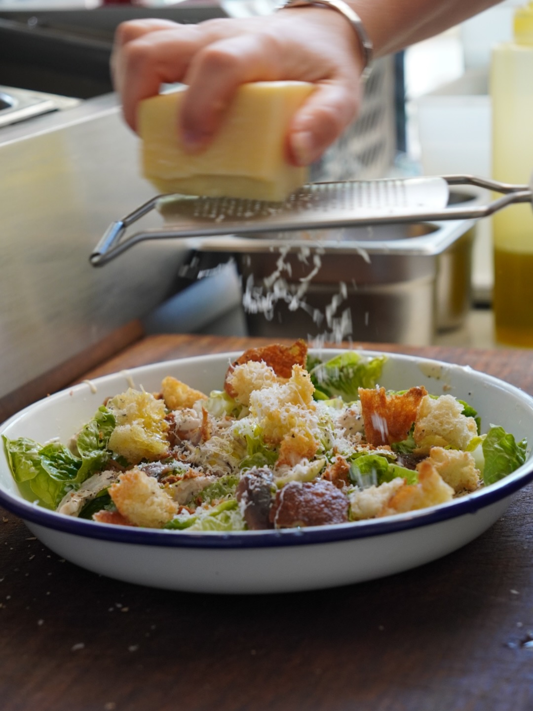 A salad finished with freshly grated cheese